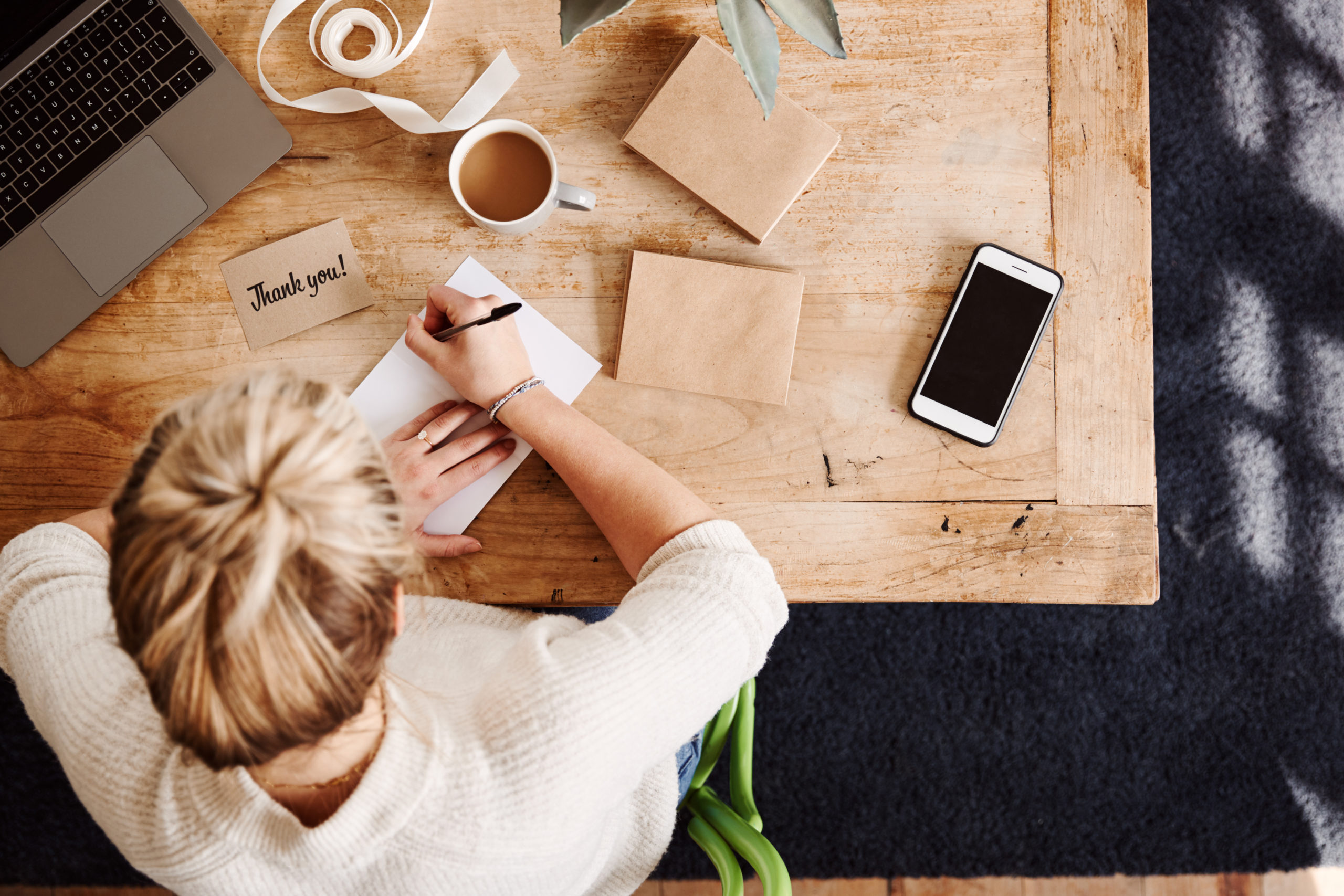 Overhead,Shot,Looking,Down,On,Woman,Writing,In,Generic,Thank